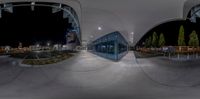 this is an image of a 360 - view of a skateboard park at night