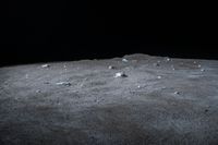 a scene of some rocks on the surface of a barren area in the night sky