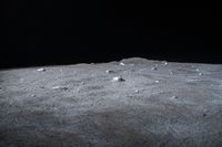 a scene of some rocks on the surface of a barren area in the night sky