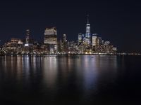 Night Skyline of New York City with Modern Architecture and Lake Reflection