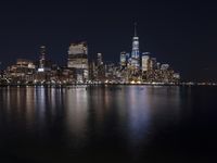 Night Skyline of New York City with Modern Architecture and Lake Reflection