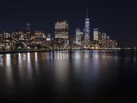Night Skyline of New York City with Modern Architecture and Lake Reflection