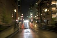 Night Skyline of Portland, Oregon Cityscape with Skyscrapers and Rain