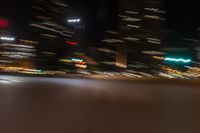 an image of street at night from inside the car window with blurry lights on