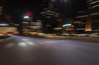 an image of street at night from inside the car window with blurry lights on