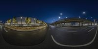 a fisheye lens photograph shows an empty street at night in the city of las vegas