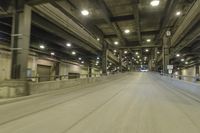 the inside of a subway with traffic lights on it's ceiling and a car coming down the road