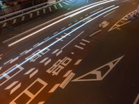 an image of outside of the night time building with the lights turned on and the streets empty