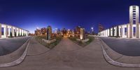 the street in front of a large city has been reflected in a fish eye lens