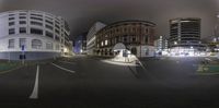 an image of a street view in the night time with no traffic lights on it