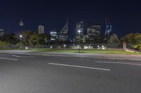 the street is empty at night with no people in sight on the road and buildings to the side