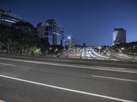 Night Time Cityscape: High Rise Buildings Illuminated by Artificial Light