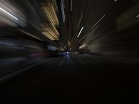 blurred view of city buildings from street light at night time with long exposure lensed