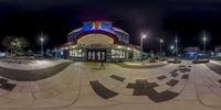 a fisheye shot of a restaurant and surrounding area at night time with stars in the sky