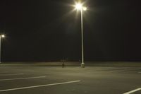 Night Time Street in a City with Parking Lot and Stadium