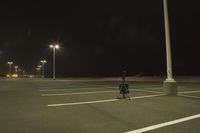 Night Time Street in a City with Parking Lot and Stadium