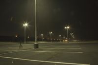 Night Time Street in a City with Parking Lot and Stadium