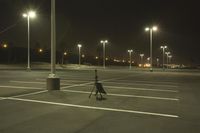 Night Time Street in a City with Parking Lot and Stadium