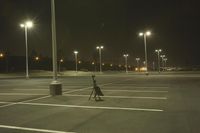 Night Time Street in a City with Parking Lot and Stadium