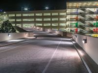 a view of a road and an overpass with traffic passing through it by buildings