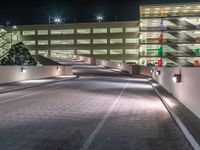 a view of a road and an overpass with traffic passing through it by buildings