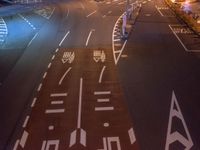 an image of outside of the night time building with the lights turned on and the streets empty