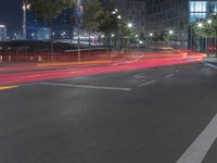 the street has been taken over by a building at night with long exposure on the road