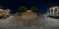 street and buildings in a small town at night, seen from the front angle of the camera