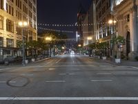 a deserted city street filled with traffic at night time at dusk, with lights on