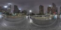 this photo shows the traffic at night time in an urban setting and it's not dark