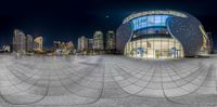 a wide angle shot of an urban city at night from a fish eye lens with motion bluring