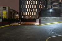 a man in the parking lot near some tall buildings on a nighttime day or night