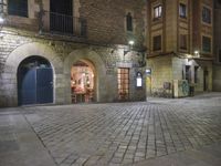 Night View of Barcelona City Street with Historic Architecture and Shopfronts