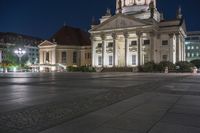 Night View of Berlin Architecture with City Lights and Water