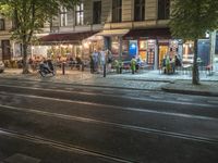 Night view of Berlin city road with residential buildings and artificial light