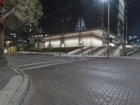 Night View of City with Illuminated Buildings and Roads