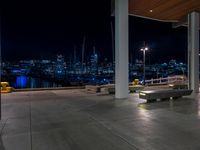 Night View of Cityscape with Coastal Water and Road