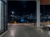 Night View of Cityscape with Coastal Water and Road