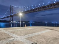 Night View of Coastal Bridge in Lisbon, Portugal