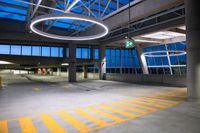 this is a parking garage with no people in it at night time under the neon lights