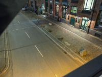 Night view of Hamburg cityscape with yellow high line road and classic architecture