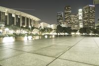 a view of a very big city at night time with a lot of lights on