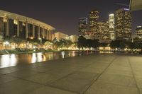 a view of a very big city at night time with a lot of lights on