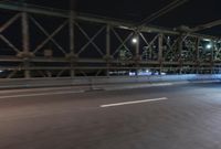 Night view of New York City architecture and road
