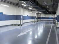 two large parking spaces with parking meters attached to them in a building at night,