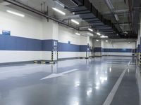 two large parking spaces with parking meters attached to them in a building at night,