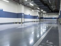 two large parking spaces with parking meters attached to them in a building at night,