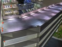 a view of a road and an overpass with traffic passing through it by buildings