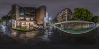 an image of a street view at night with a mirror reflecting on it's sides