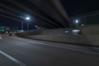 Night view of underpass and bridge in New York City